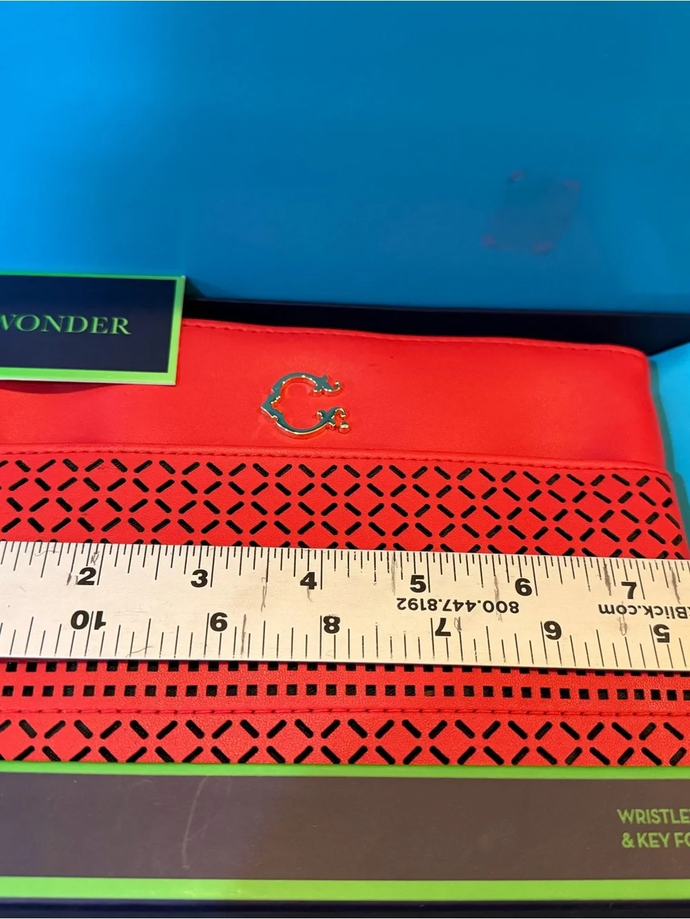 Red-Orange Laser-Cut Wristlet Clutch by Wonder